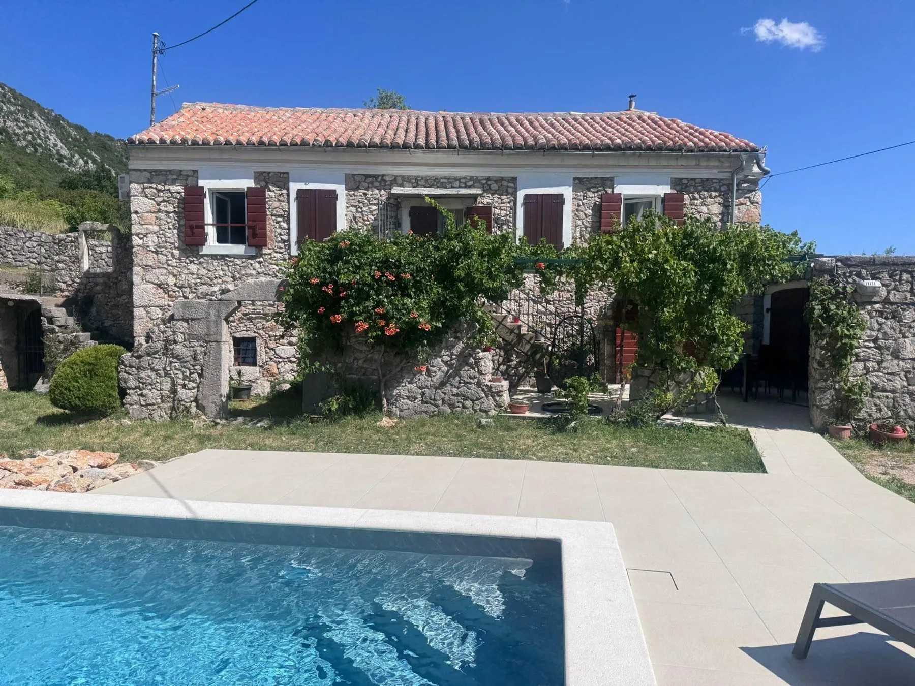 The stone house above the pool, head on