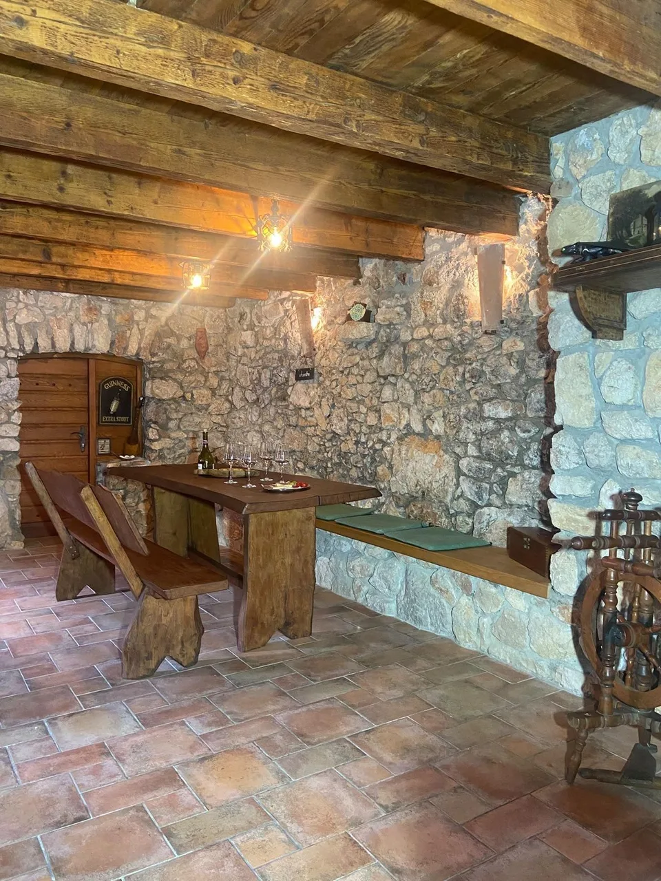 A corner of the konoba: the table and a stone wall