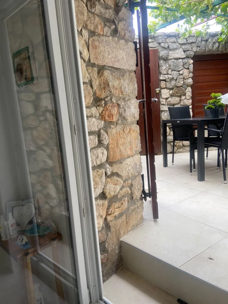 The terrace table, seen through the open door